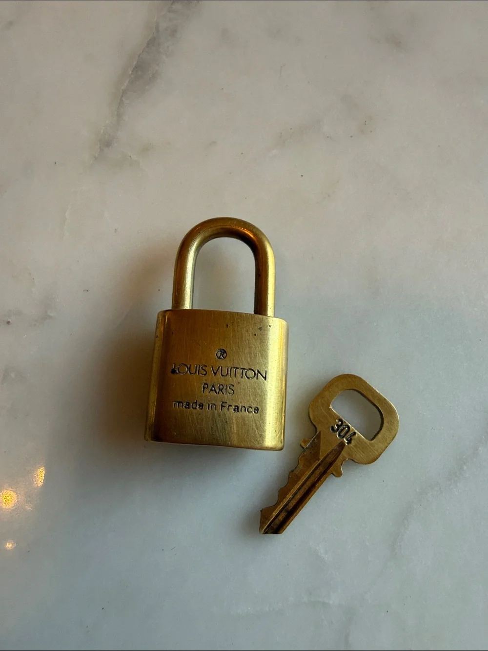 Authentic Louis Vuitton Brass-Tone Padlock and Key Set